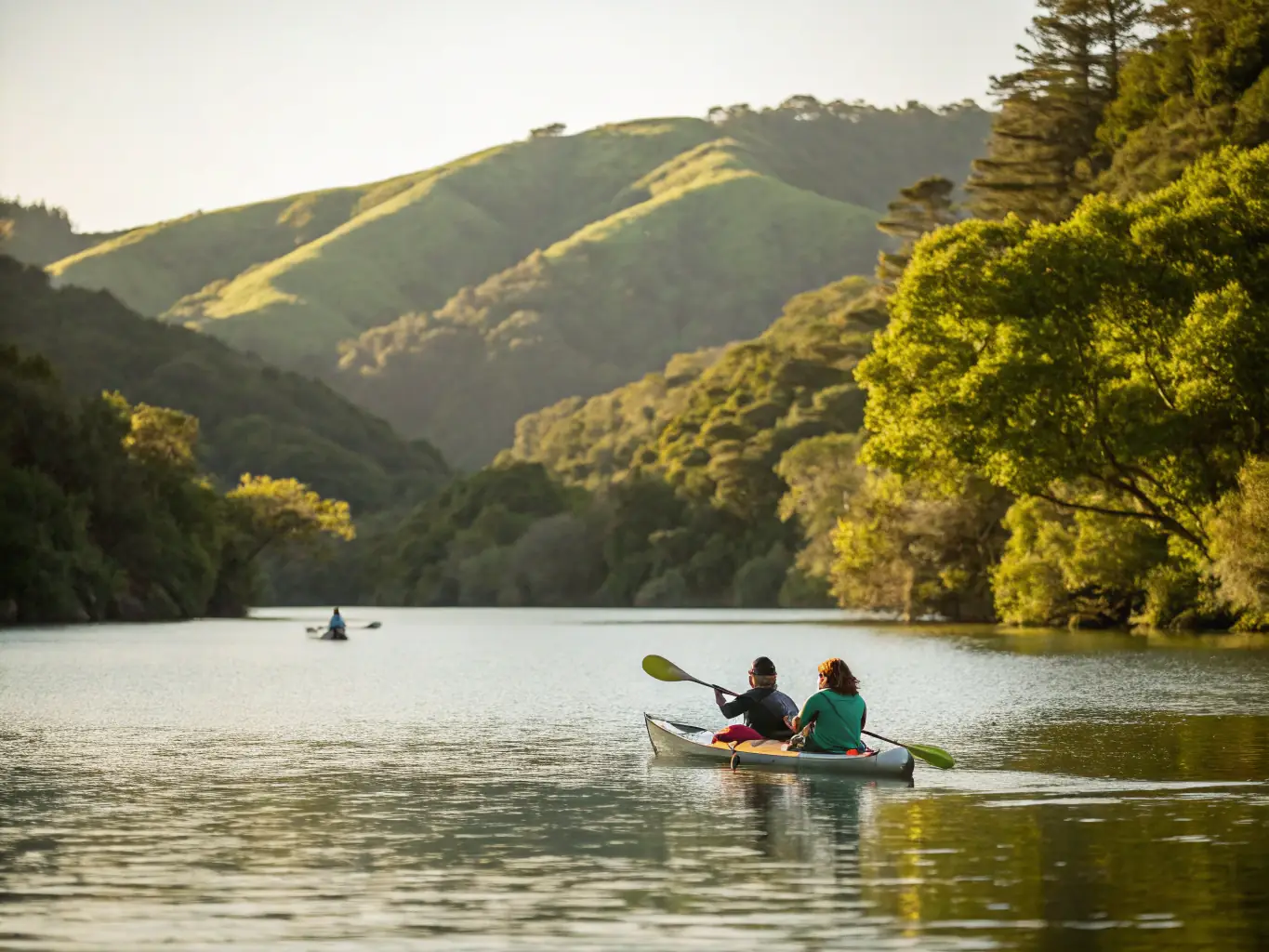 A scenic image of a kayak gliding through calm waters, representing the CLUB NAUTIQUE DE PORT DIEU's kayaking program. The image should evoke a sense of peace, adventure, and connection with nature.